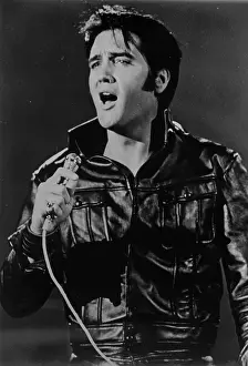 Rock and roll musician Elvis Presley performing