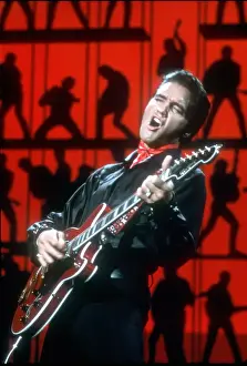 Rock and roll musician Elvis Presley performing