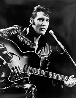 Rock and roll musician Elvis Presley performing