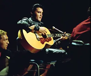 Rock and roll musician Elvis Presley performing