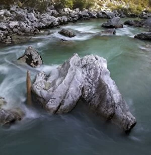Rock in the turquoise Soca river, Soca Valley near Bovec, Triglav National Park, Slovenia, Europe