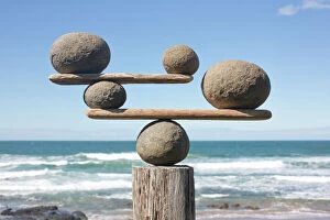 Skill Gallery: Rocks balancing on driftwood, sea in background