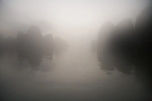 Images Dated 7th November 2005: Rocks and water through mist at dawn
