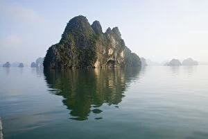 Images Dated 7th November 2005: Rocky islands with still water in misty morning