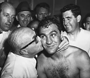 Rocky Marciano Getting Kiss from Al Weill