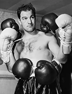 Rocky Marciano With Many Gloves