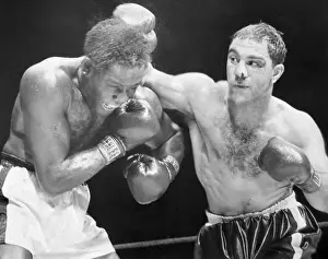 Rocky Marciano Hits Ezzard Charles Head