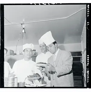 Rocky Marciano Inspecting a Steak