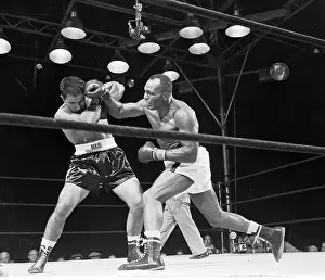 Rocky Marciano and Joe Walcott in Boxing Action