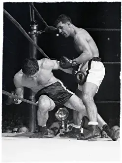 Rocky Marciano Punching Boxer in Corner