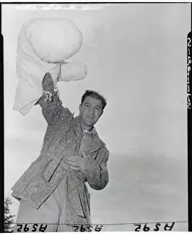 Grossinger Prints: Rocky Marciano Raising Oversized Glove