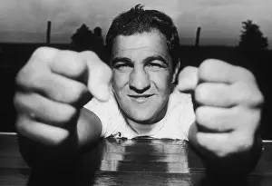 Prints of 10th August 1969: Closeup of American boxer Rocky Marciano (1923 - 1969) clenching his fists. Marciano was preparing for his fight against Ronald La Starza. (Photo by Patrick A) In the Ring: The Art of Boxing: Rocky's Fists