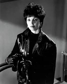 Prints of LOS ANGELES - 1983: Singer Pat Benatar poses for a photo on the set of the music video for Rodney Dangerfield's Rappin Rodney in 1983 in Los Angeles, California Heartbreaker on Stage: Pat Benatar in Performance: Rodney Dangerfield Music Video