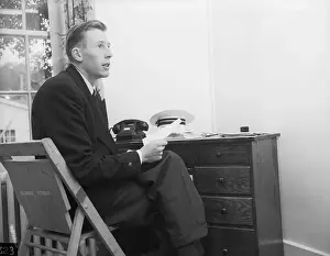 Vancouver Prints: Roger Bannister Sitting at Desk
