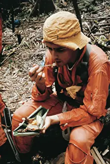Roger Chaffee Eating in Jungle