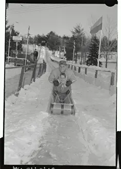 Grossinger Prints: Roger Maris Pushing His Wife on Toboggan