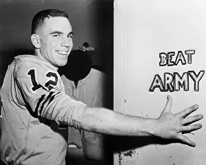 Quarterback Prints: Roger Staubach Beside Beat Army Sign