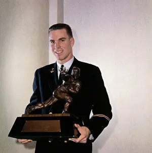 Roger Staubach Holding Heismann Trophy