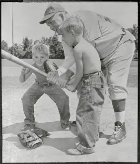 Rogers Hornsby Teaching Young Boy How to Handle Baseball Bat