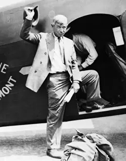 Will Rogers Standing At Plane Entrance