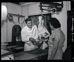 Roland La Starza Cutting Meat in Butcher Shop