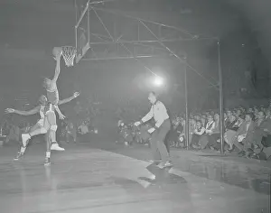 Roland Minson Scoring a Basket
