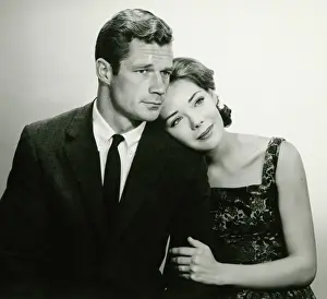 Romantic couple in studio, (B&W), portrait