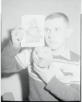 Ronald Mucha Holding a Pumpkin and Photograph