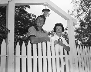 Malibu Prints: Ronald and Nancy Reagan Standing Behind Fence