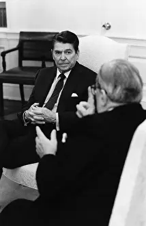 Officials Prints: Ronald Reagan in Chair Listens to a Man