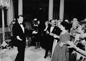 Ronald Reagan Gesturing to His Guests