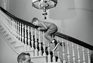 Sacramento Prints: Ronald Reagan, Jr. Sliding Down Stair Banister
