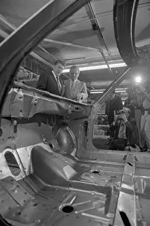 Ronald Reagan and Lee Iacocca Examining Frame