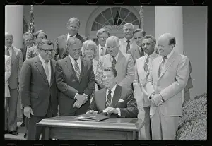 Ronald Reagan Posing at Desk