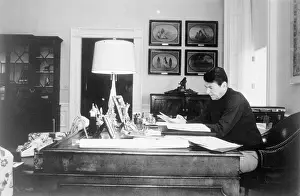 Ronald Reagan Reading at Desk