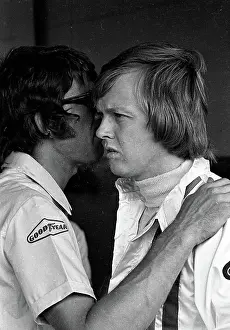 Prints of Swedish Formula One driver Ronnie Peterson (1944 - 1978) (right) listens as an unidentified crew member talks in his ear during the Argentine Grand Prix, Buenos Aires, Argentina, January 29, 1973 Legends of the Track: Ronnie Peterson At The Argentine Grand Prix