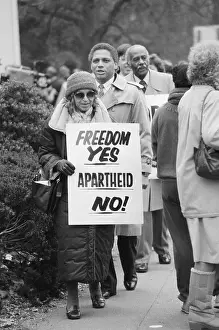Prints of Civil rights heroine Rosa Parks carries a sign outside the South African Embassy in Washington. It reads Freedom Yes, Apartheid No! | Location: Embassy of South Africa, Washington, D.C. USA Echoes of Justice: Civil Rights in Focus: Rosa Parks Protesting Apartheid