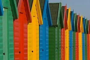 Row of multi-coloured beach huts