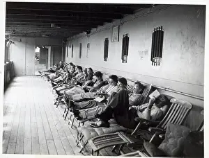 Row of Passengers on Ship Deck Chairs