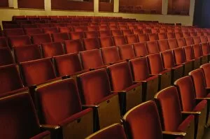 Rows of red seats in theatre