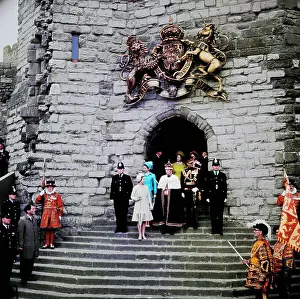 Royal Family Standing in Front of Building