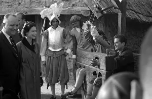 Prints of JAMESTOWN, VA - OCTOBER 16: Queen Elizabeth II is amused by the stocks while being given a guided tour of the re-created Jamestown Fort in Jamestown, Virginia Queen Elizabeth II Prints: Royal Visit To Virginia