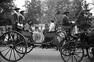 Prints of JAMESTOWN, VA - OCTOBER 16: Queen Elizabeth II leaves Jamestown Festival Park by coach on her way to a reception at the Governor's Palace in Colonial Williamsburg in Jamestown, Virginia Queen Elizabeth II Prints: Royal Visit To Virginia