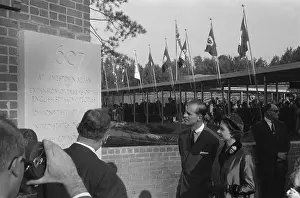 Prints of JAMESTOWN, VA - OCTOBER 16: Queen Elizabeth II and Prince Philip, Duke of Edinburgh look at a plaque commerorating the 350th anniverasy of the founding of the Jamestown colony in Jamestown, Virginia Queen Elizabeth II Prints: Royal Visit To Virginia