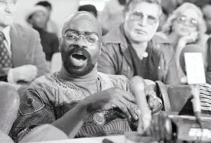 Clinton Prints: Rubin Carter Speaking to Press