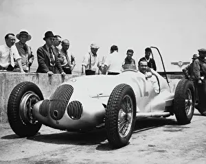 Prints of German racing driver Rudolf Caracciola sitting in his Mercedes-Benz car, circa 1937. Caracciola raced for Mercedes-Benz during the German manufacturer's Silver Arrows period and for Alfa Romeo Legends of the Track: Rudolf Caracciola, German Racing Driver
