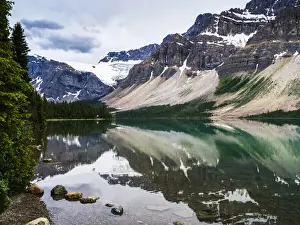 Rugged Prints: Rugged Canadian Rocky Mountains and glaciers reflected in a tranquil lake