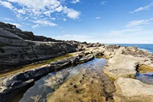 Flooded Prints: Rugged coastline with eroded sandstone on the Moray Firth at Tarbat Ness