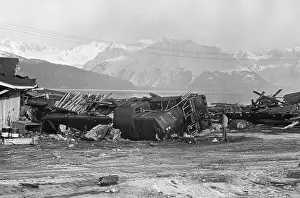 Earthquake Prints: Ruined Railroad Cars Before Mountains