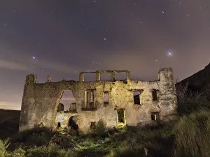 Ruins of a farmhouse at night